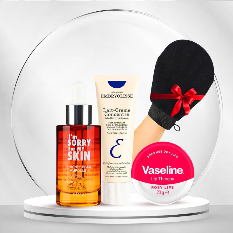 Embryolisse Lait-Crème Concentré, I'm Sorry For My Skin Honey Beam Ampoule, Vaseline Rosy Lips and a black mitt in a skincare gift display.
